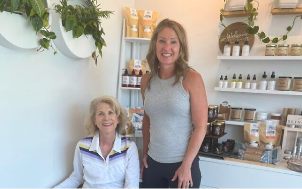 Julie Stewart, owner of Utopia, stands with Marcia, a dedicated mentor.