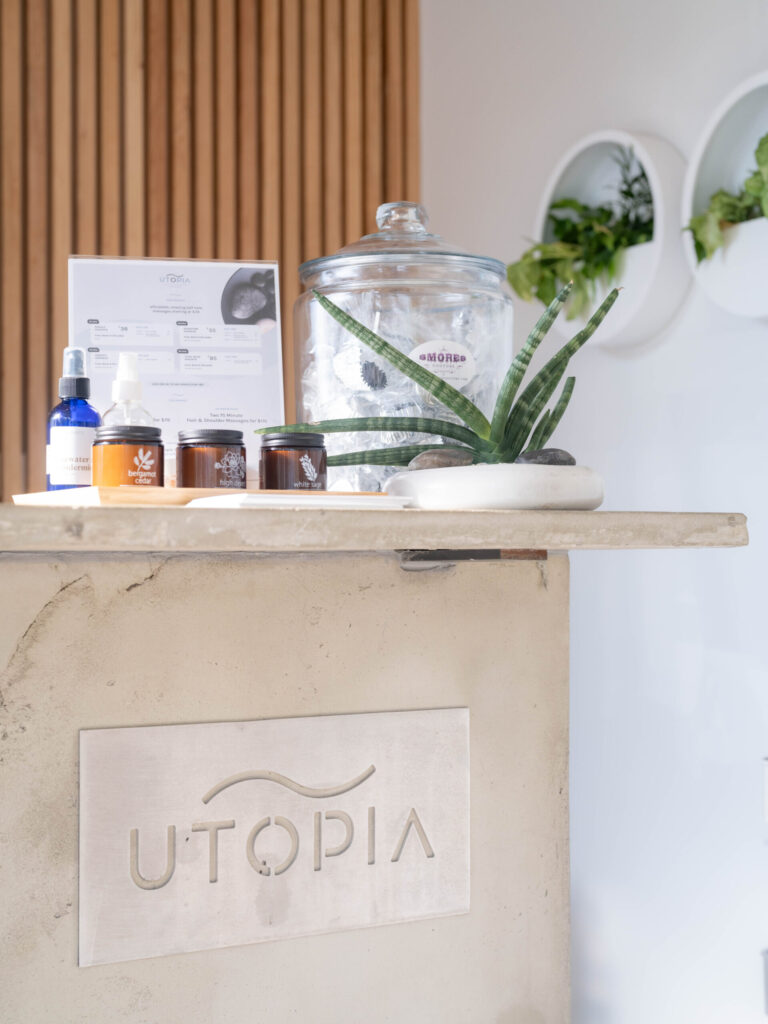 reception desk decorated with greenery and cosmetics